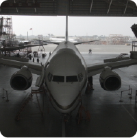 Front view of a commercial aircraft on the tarmac